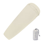 A white background image featuring a sky-blue sleeping bag liner.