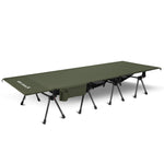 Green camping cot with legs on a white background