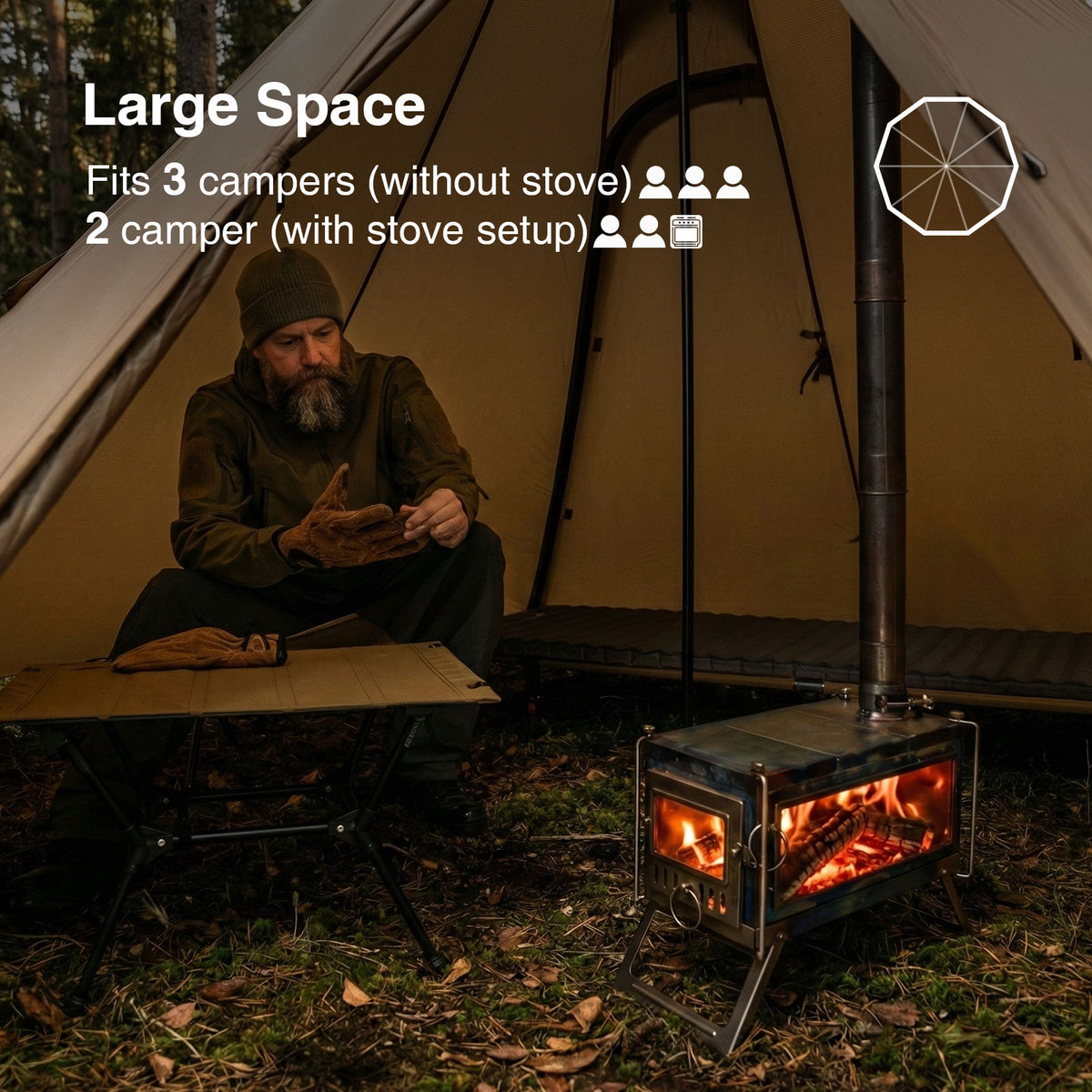 Man sitting by a tent with a stove setup, indicating space for multiple campers.