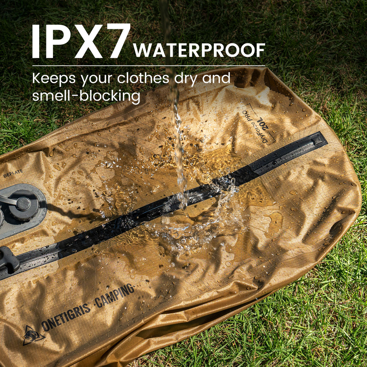 A OneTigris camping storage bag sits on the grass, with water being poured directly onto the zipper area. Large text at the top reads "IPX7 Waterproof" and "Keeps clothes dry and seals in odors."