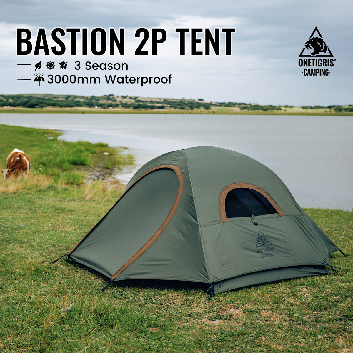 An olive green Onetigris Bastion 2P tent pitched on a grassy lakeside with water and distant land visible. Text on the image reads 'BASTION 2P TENT' with features '3 Season' and '3000mm Waterproof,' and the Onetigris Camping logo appears in the top right.