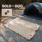 Inflatable camping mattress with side SNAP design for converting from solo to duo setup, outdoors.