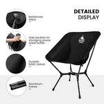 Black folding chair with features highlighted on a white background