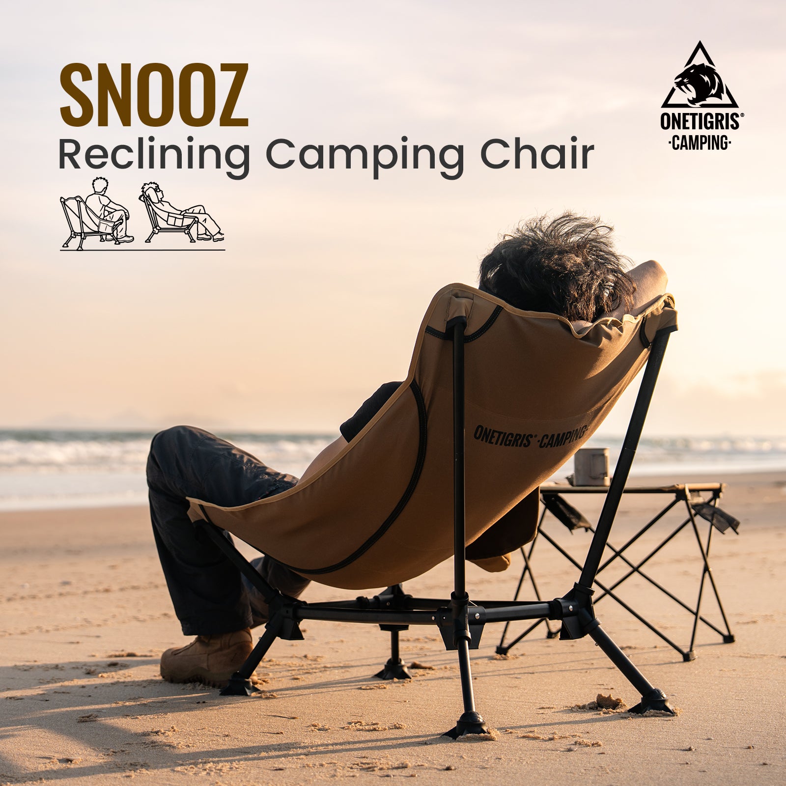 Person using a reclining camping chair on a beach with 'SNOOZ' and 'ONEGRIS CAMPING' branding.