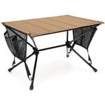 Portable camping table with beige top and black legs on a white background