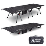 Black camping cot with adjustable legs and carrying bag on a white background