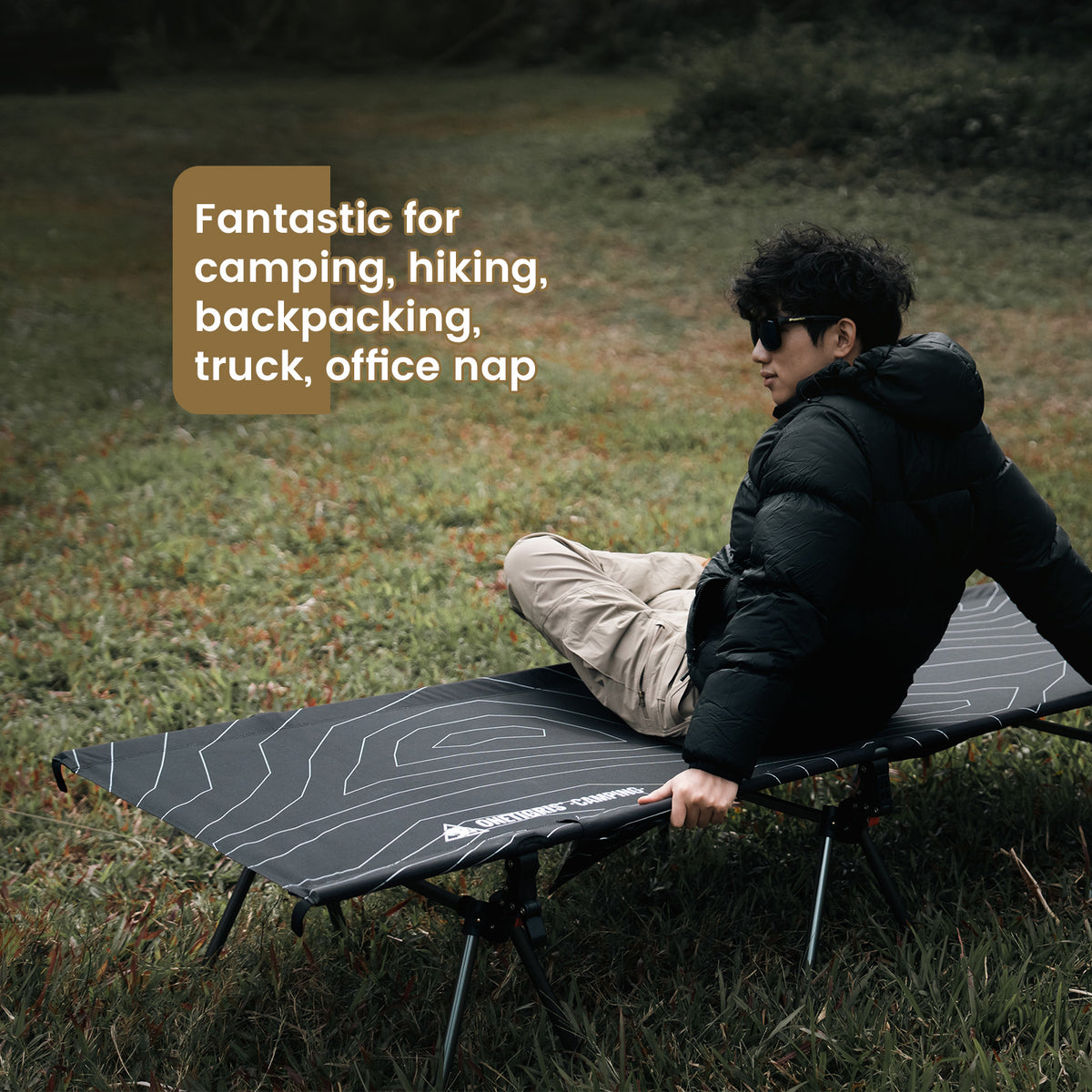Person sitting on a camping cot in a grassy area with text about its uses.